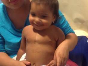 Adriana (2) is back for a check-up with a smile.