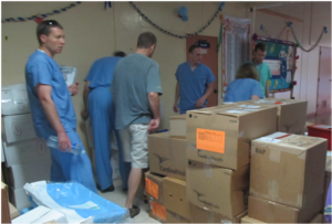 Team Prepares to Unpack Surgical Supplies
