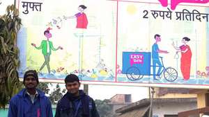 Lalbabu and Naveen pose under an EasyBin banner