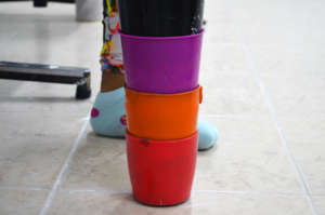 A prosthesis crafted with colorful plastic cups.