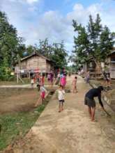 Everyone working hard to clean the village!