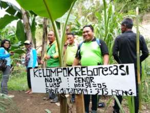 ASRI staff replanting at the Reforestation site