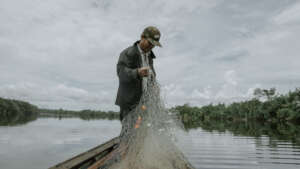 Pak Karim preparing to fish from his boat