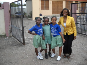 CEO Nikiki Bogle with students - St. Peter Claver