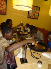CEF Scholars having pizza in New Kingston