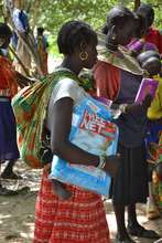 Mother receiving her free mosquito net