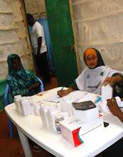 One of our female nurses dispensing medicine