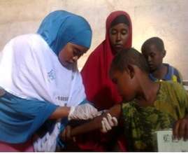 A child receiving vaccinations at a RI clinic
