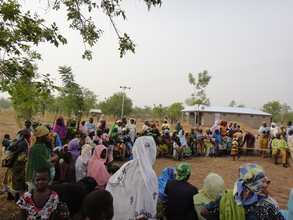 Community members arrive for the opening ceremony.