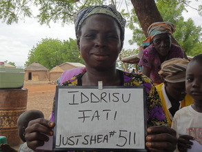 Her solar light helps her see to collect more shea