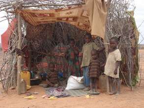 Brothers and sisters gather in a makeshift shelter