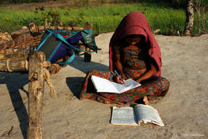 Finally, after dinner she has time for homework!