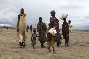Family leaving the stabilization center with food.