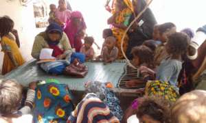 AHD women program manager preparing list of young