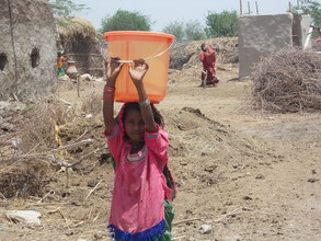 A Young girls of 9 years fetch drinking water