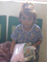 A girl happy to receive health kit