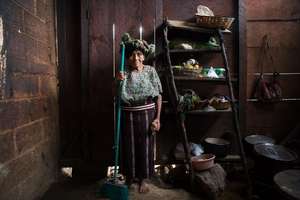 An elderly women taking care of the house