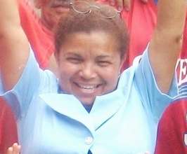 Maribel celebrates her new rain catchment tank