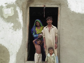 A family happy with repaired house for next rain
