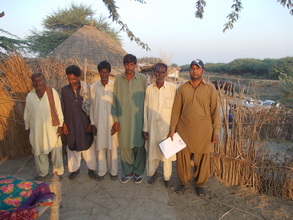 Kanji Kolh village families looking Shelter kit