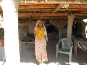 Women Repaired her house with Bamboes roof