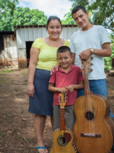 Walter, Yamile, & Walter Jr. with their guitars