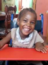 Halima in her new wheel chair