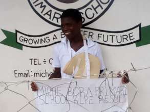 Seif outside the school