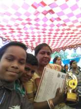 Akash with his Certificate & Remedial Teacher