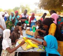Open-air art class with teacher