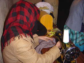 Adolescent girl learning to sew