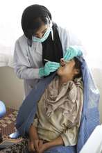 Adolescent girl visiting the dentist
