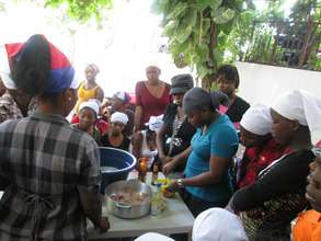 KOFAVIV mentor teaching cooking class to girls