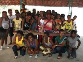 Girls posing with their crafts