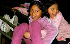 Girls play while moms attend a co-op meeting