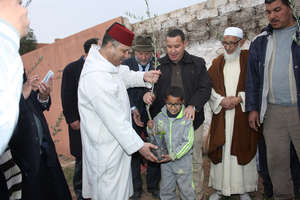 The governor, Hon. Mr. Bathaoui, at the planting.