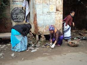 Our Volunteers helping the girls clean