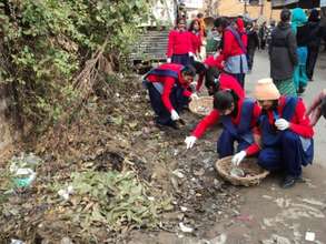 School girls cleaning to spread the word