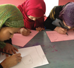 Girls learn at a 'keeping yourself safe' workshop