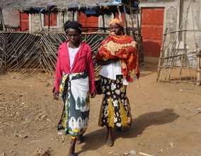 CHW Alice (right) with a premature baby and mother
