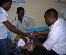 Nurses treating an ill newborn