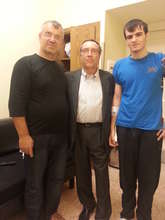 Mansur (on the right) with his dad and his surgeon