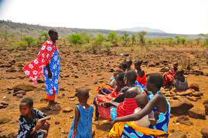 Health Worker Educates Group of Mothers in Kenya