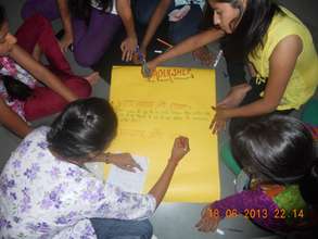 Girls preparing their assignments -at the workshop