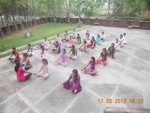 Girls doing Yoga at the residential camp
