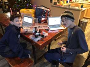 Elijah and friend working on robot