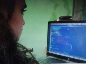 Girls learning coding in our youth club