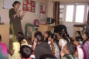 Children listening intently to the child counselor
