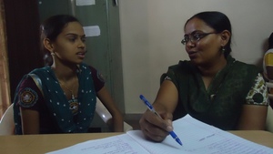 Lata (left) discussing with our social worker.