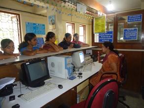 Girls learning the services of Bank